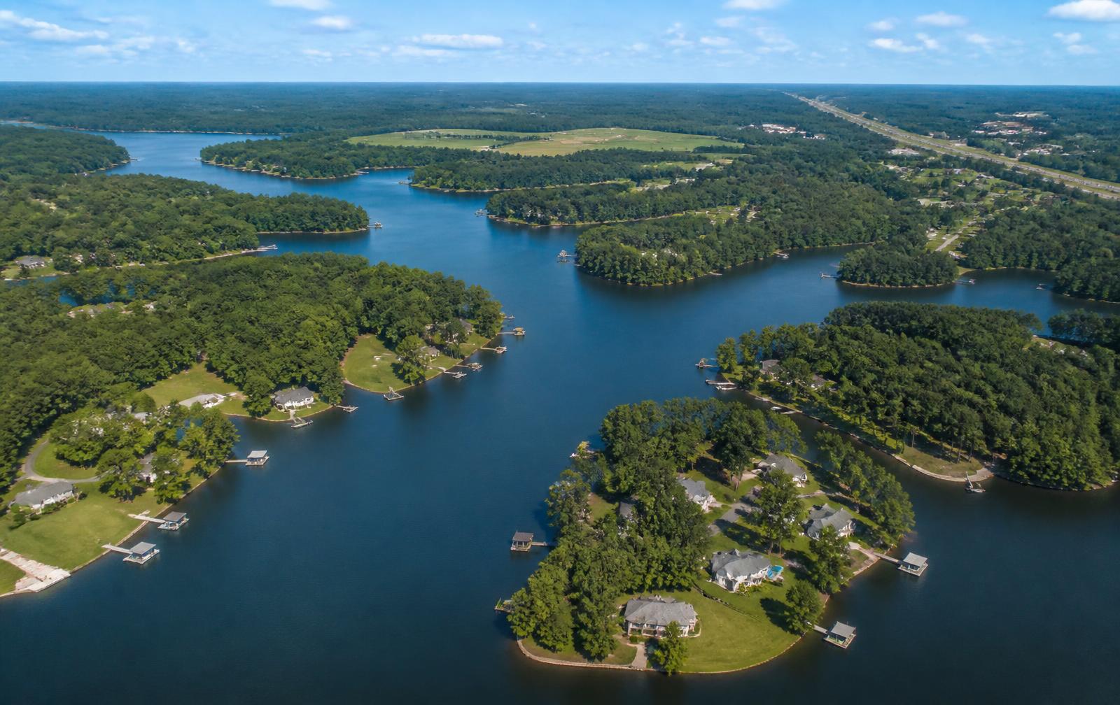Aerial view of wooded Carolina lake coves with docks and waterfront homes